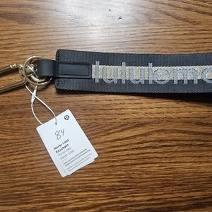 Lululemon Black & Gold NEVER LOST Keychain